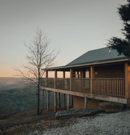 cabin with large deck at sunrise