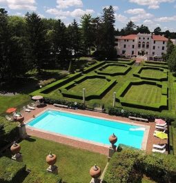 hotel with gardens and pool