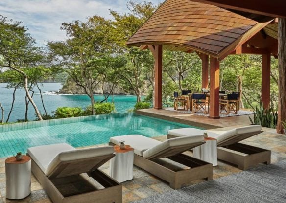 pool with lounges with cabanas at four season