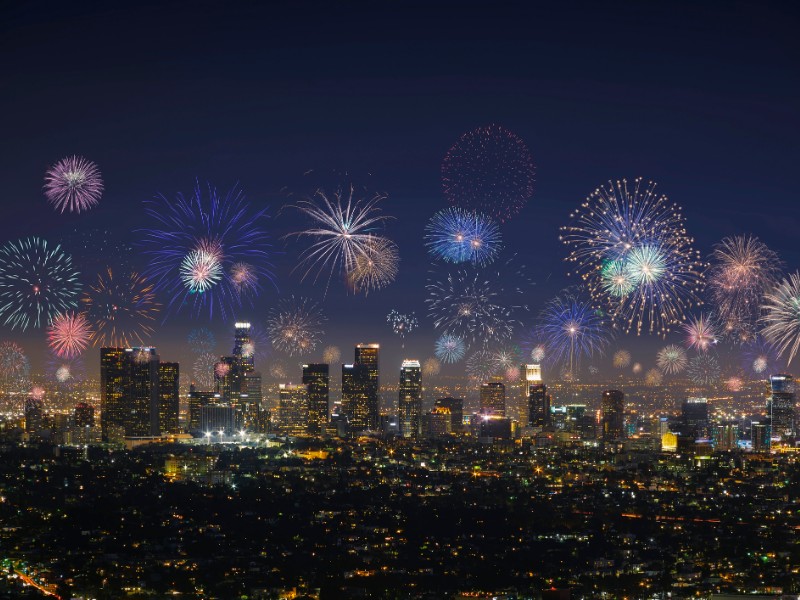 Downtown Los Angeles with exploding fireworks during New Years Eve