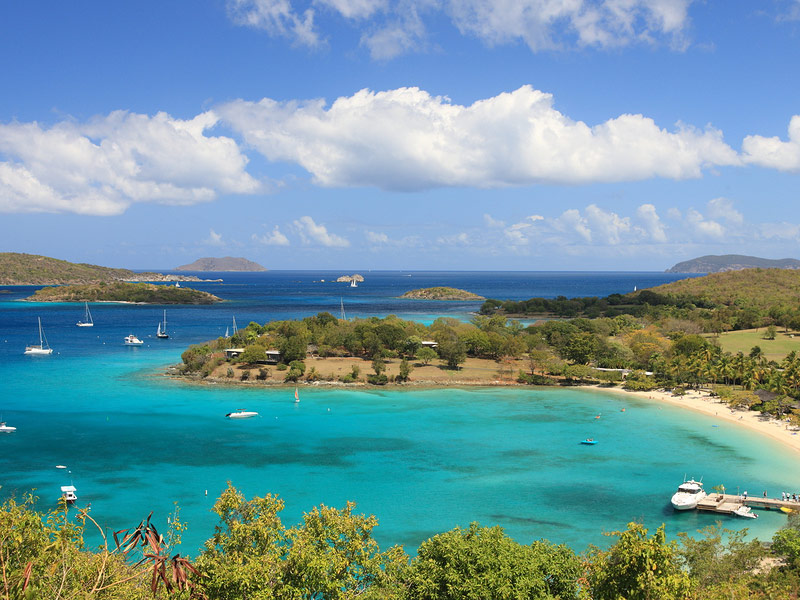 turquoise lagoon surrounded by island of green vegetation