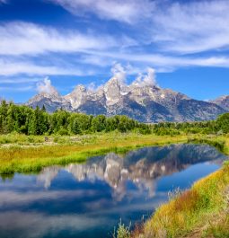 craggy mountain peaks reflected in still water