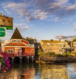 Welcome to Kennebunkport sign on bridge in front of town on the water