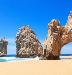 Rock formation on a beautiful beach edging a turquoise sea