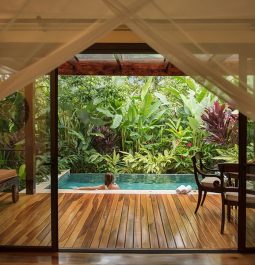 view of pool through large glass door