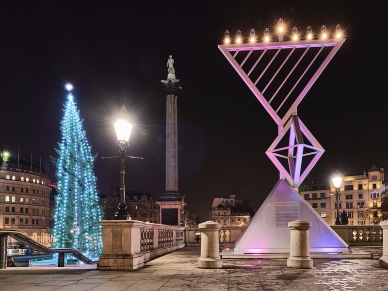 Menorah next to Christmas tree in Trafalgar Square