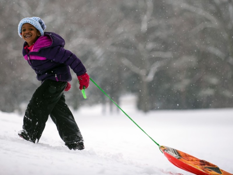 Child with sled in Minneapolis park