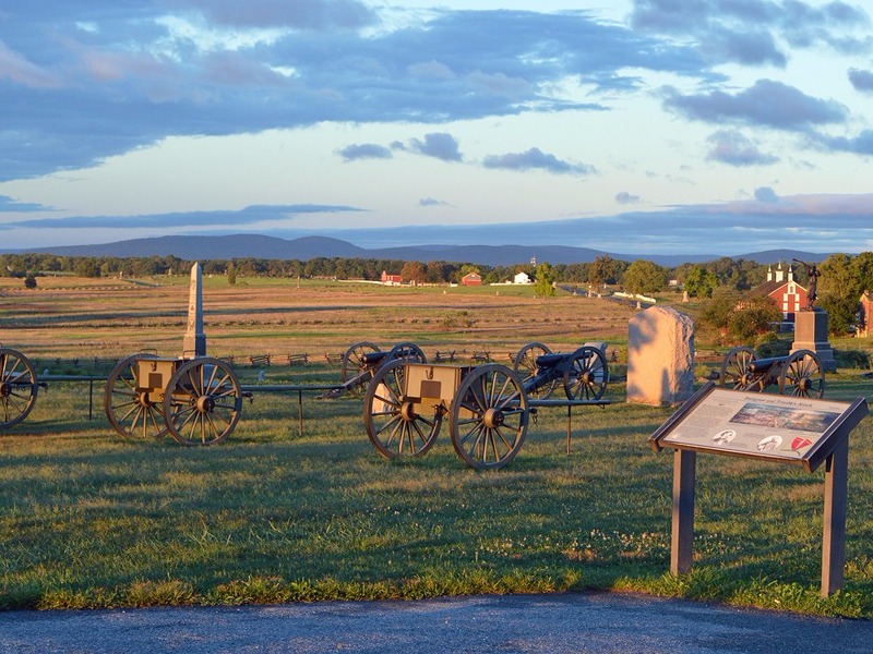 Monuments and Civil War cannons on the free driving tour at Gettysburg National Battlefield in Gettysburg