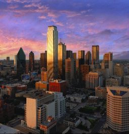 City skyline with purple sky