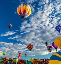 colorful hot air balloons fill the sky