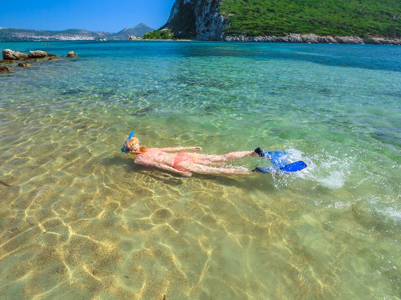 swimming at Voidokilia Beach, Peloponnese, Greece