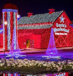 Giant red barn completely covered with Christmas lights