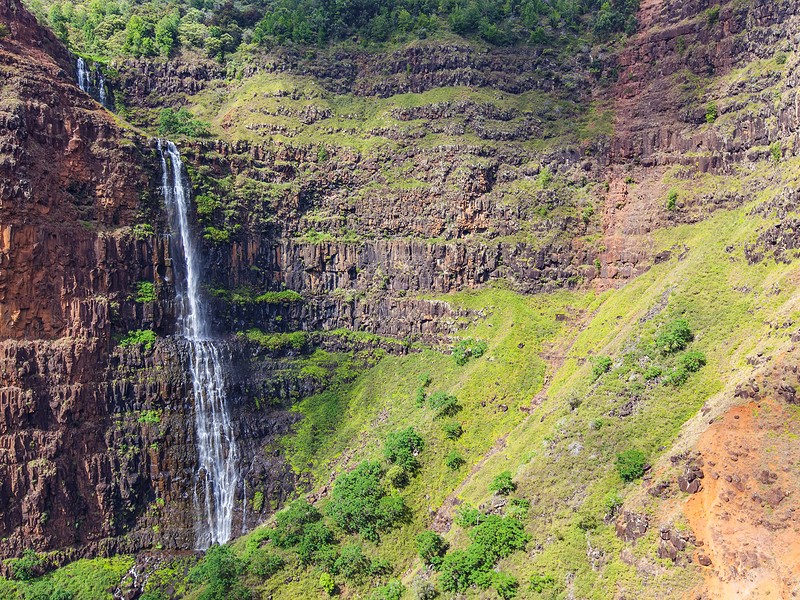 view at remote waterfall at the island of kauai hawaii from helicopter