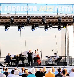 performers on stage with crowd