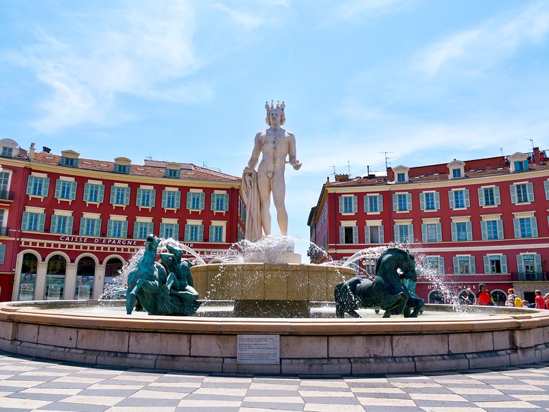 A view of the fountain Fontaine du Soleil at the Place Massena square in Nice