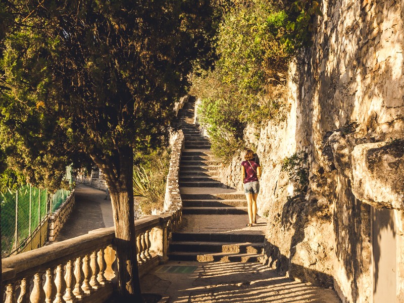 Narrow walk during sunset in Castle Hill or Colline du Chateau park in Nice