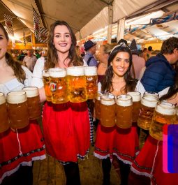 group of women holding large beers at Oktoberfest Belfast