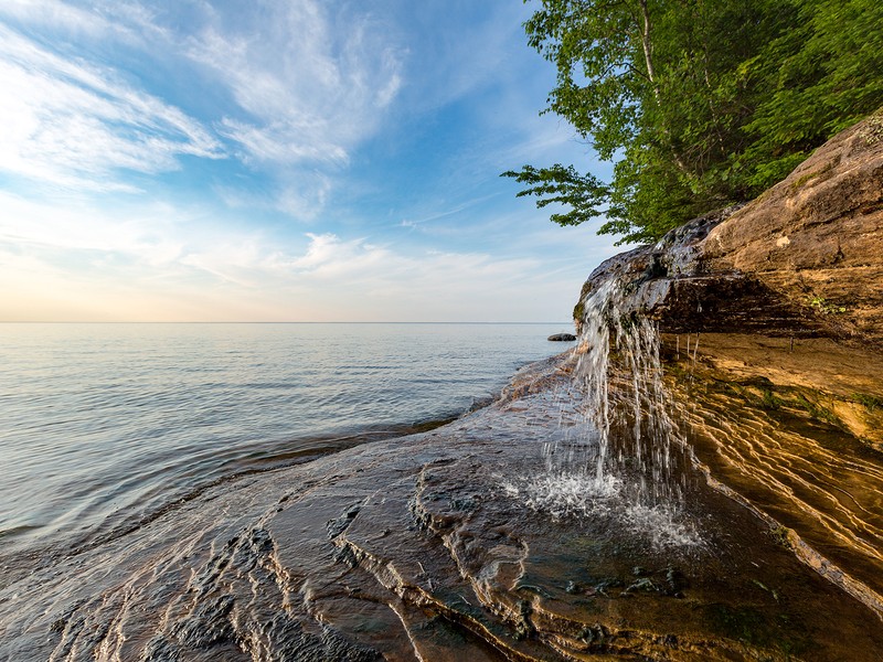 Elliot Falls spills over sculpted rock at Pictured Rocks National Lakeshore in Munising