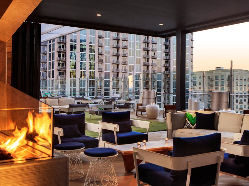 Amenities at the Kimpton Tryon Park Hotel include a rooftop bar and restaurant