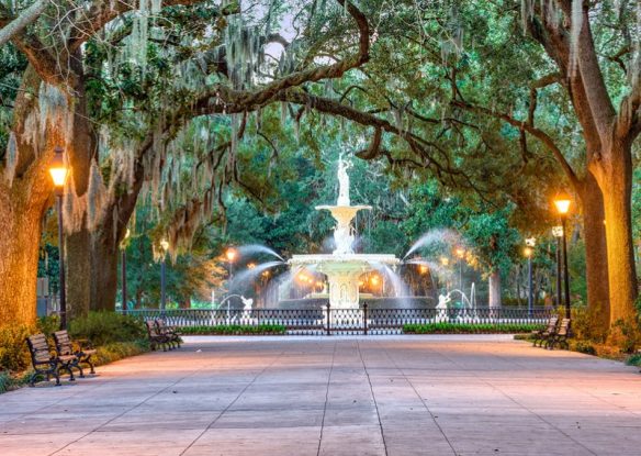 Large fountain surrounded by moss-draped trees in Savannah, Georgia