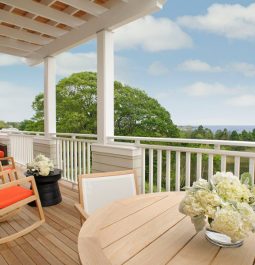 outdoor porch with patio furniture and flowers