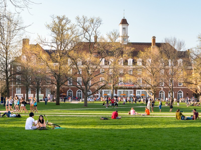 Students mingle on Quad lawn of University of Illinois college campus in Urbana Champaign