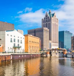 Milwaukee, Wisconsin, USA downtown skyline on the Milwaukee River in the daytime