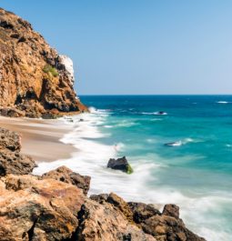 view of waves crashing on dume cove zuma beach