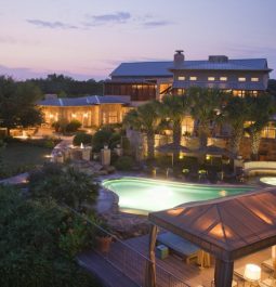 outdoor resort pool lit up at night