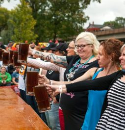 women participating in beer stein holding contest