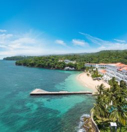 beachfront resort with pier extending into sea