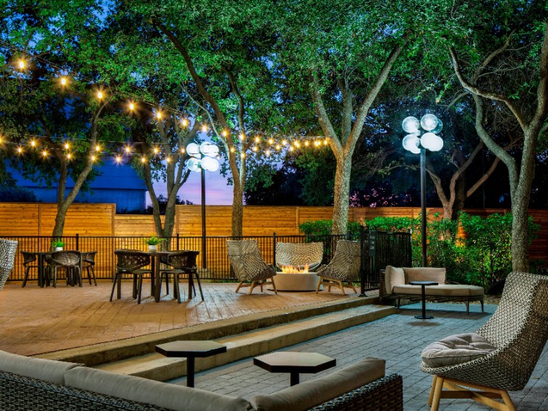 Sit on the outdoor patio at Sheraton Suites Market Center Dallas.