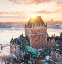 Opulent castle-style hotel next to frozen river