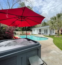 outdoor area with a pool and hot tub