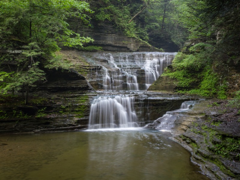 Waterfall Cascades Through Buttermilk Falls State Park