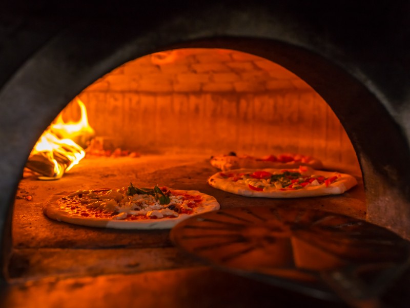  Neapolitan pizza baked in a traditional wood oven, Naples, Italy