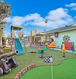 outdoor play area with pool and toys