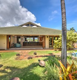 Villa with indoor/outdoor atmosphere next to lush garden and pool area