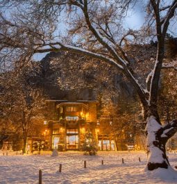 hotel at night with mountain backdrop in the winter