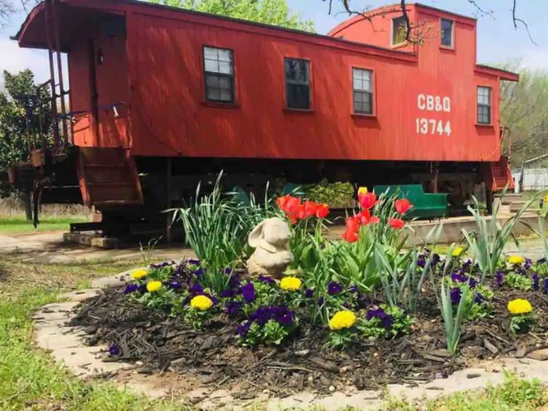 Flowers at Route 66 Oklahoma City 1925 Red Caboose