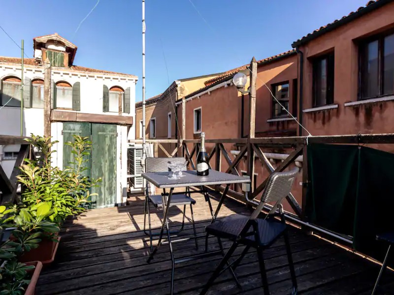 Outdoor seating at Three-Bedroom Townhouse with Rooftop Terrace