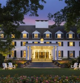 historic inn at sunset with the lights on