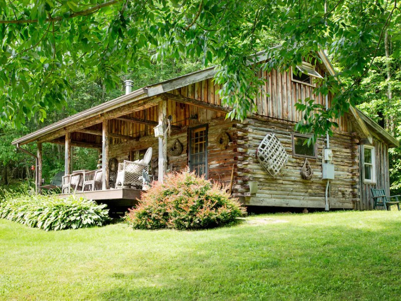 View of Charming Log Cabin on Private Pond