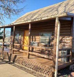 covered front porch of log cabin