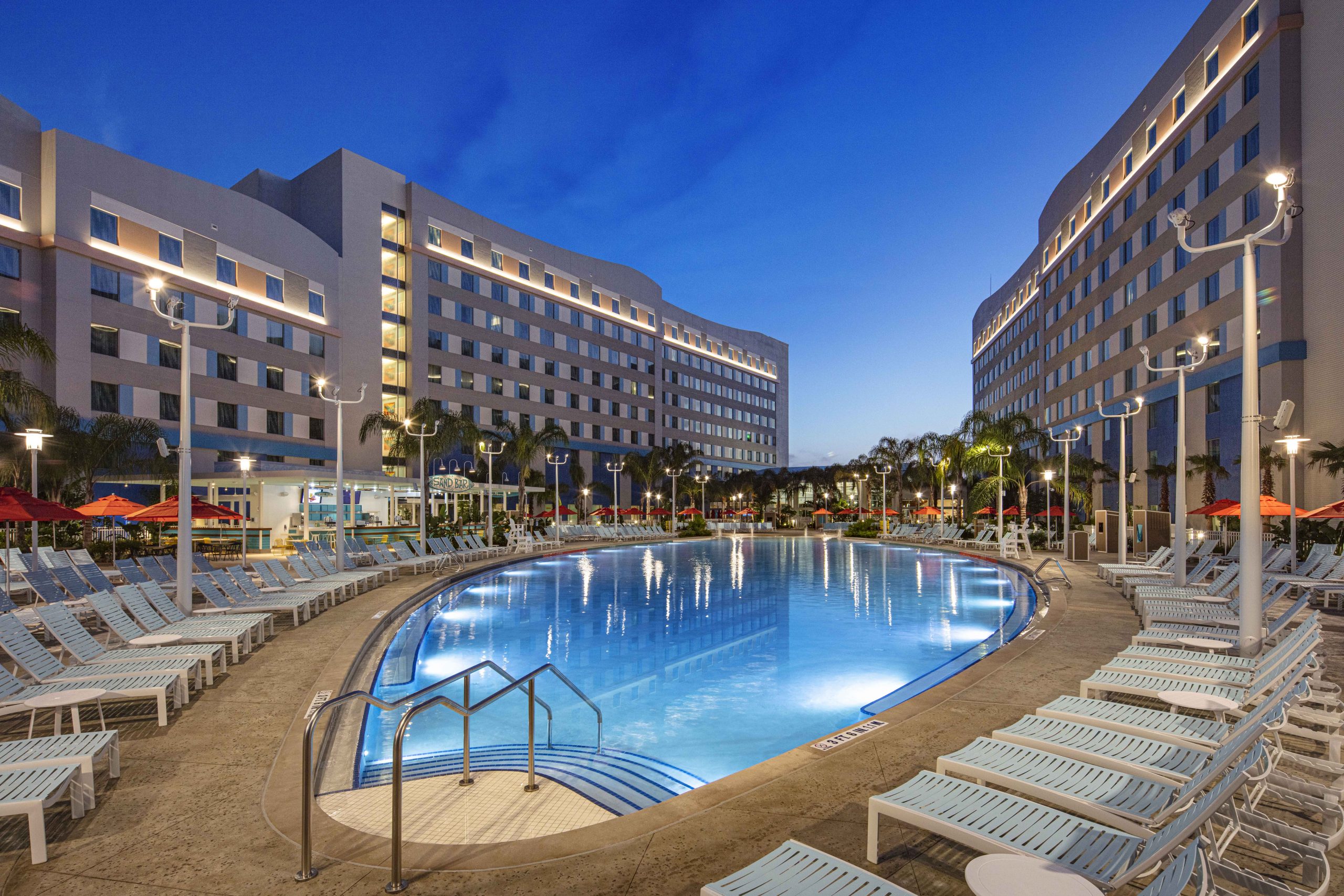 The pool at Universal's Endless Summer Resort - Surfside Inn & Suites is shaped like a surfboard.