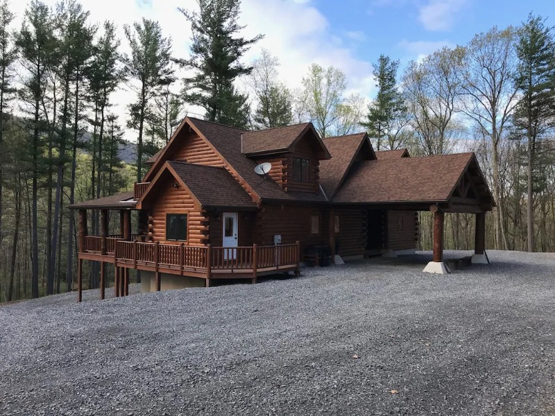 Side View of Luxury Log Cabin on Private 25-Acre Wooded Lot