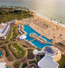 aerial show of outdoor pools and sandy beach