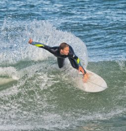 A surfer rides the waves at Sebastian Inlet, Florida