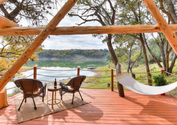 Patio scene with hammock and water view