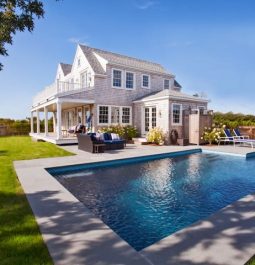 Property view of pool with house in background